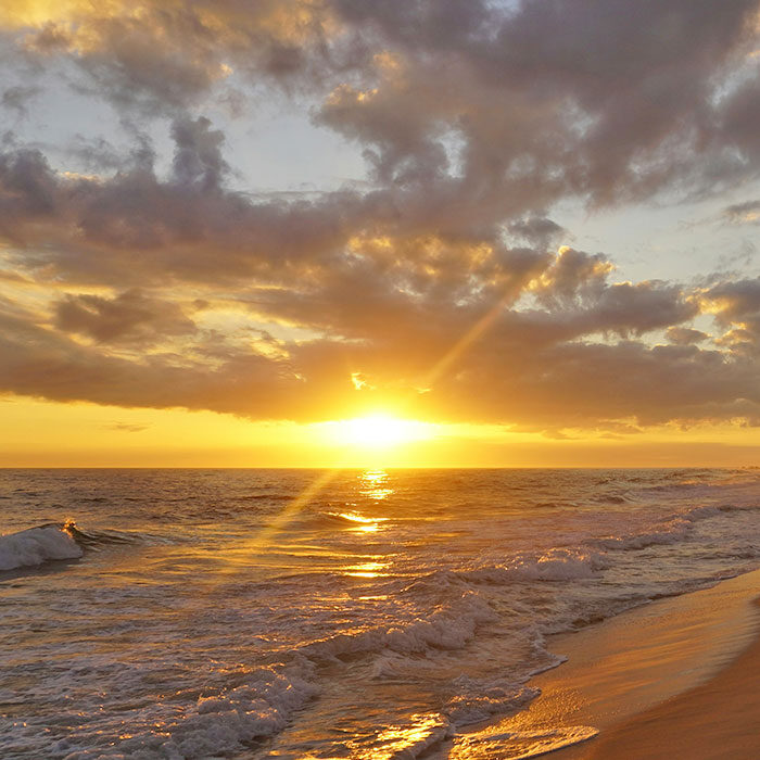 sunset on the gulf of mexico in gulf shores alabama